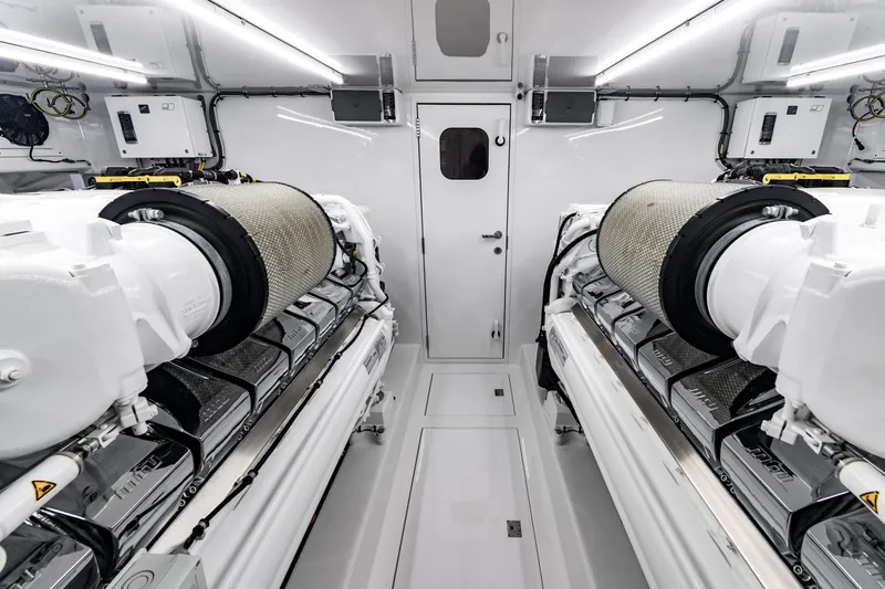 Slide: The Image of Engine room of 2020 Jarrett Bay 84 yacht, featuring dual powerful engines and modern equipment. - 94