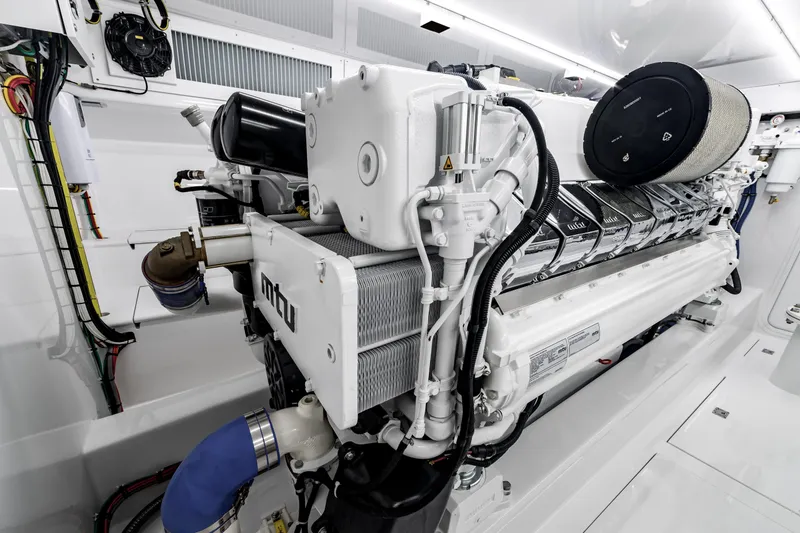 Slide: The Image of Engine room of 2020 Jarrett Bay 84 yacht featuring MTU engine components. - 95