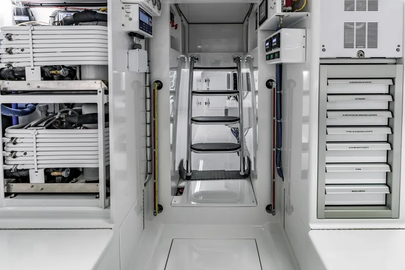 Slide: The Image of Engine room of 2020 Jarrett Bay 84 yacht, featuring organized equipment and storage. - 98
