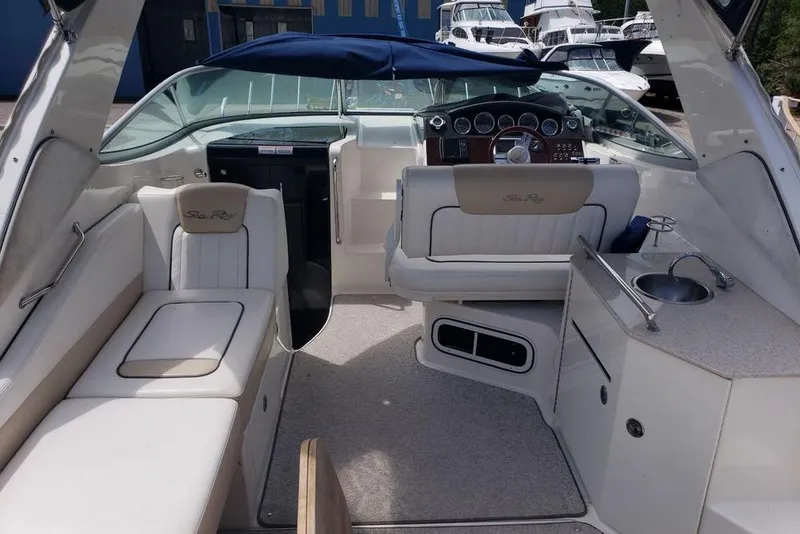 Slide: The Image of Interior of a 2010 Sea Ray Sundancer 310 boat with seating and helm. - 2