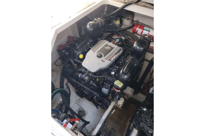 Slide: The Image of Engine compartment of a 2010 Sea Ray Sundancer 310 boat, featuring a MerCruiser 350 engine. - 9
