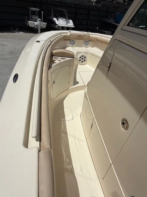 Slide: The Image of 2017 Scout 275 LXF boat interior with seating area. - 11