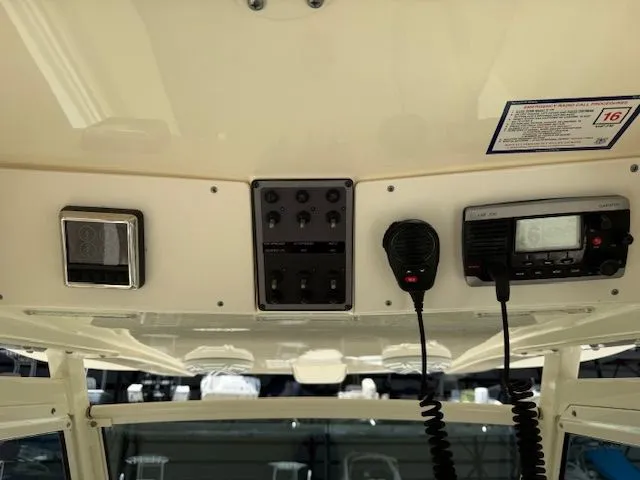 Slide: The Image of Control panel of a 2017 Scout 275 LXF boat with radio. - 20