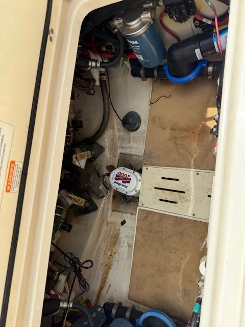 Slide: The Image of Engine compartment of a 2017 Scout 275 LXF boat with technical components. - 27