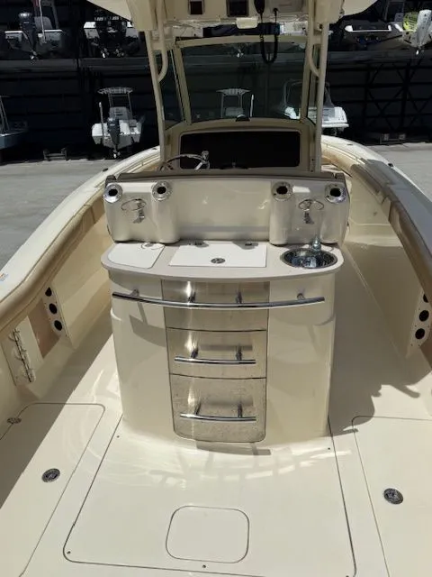 Slide: The Image of Interior view of a 2017 Scout 275 LXF boat with helm console. - 7