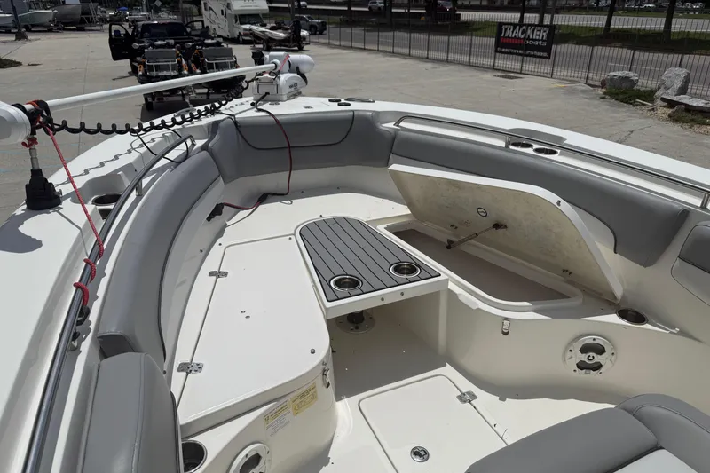 Slide: The Image of 2021 NauticStar 2602 Legacy boat interior with seating and storage compartments. - 13