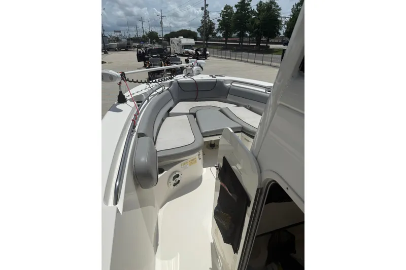 Slide: The Image of 2021 NauticStar 2602 Legacy boat interior with seating and open hatch. - 18
