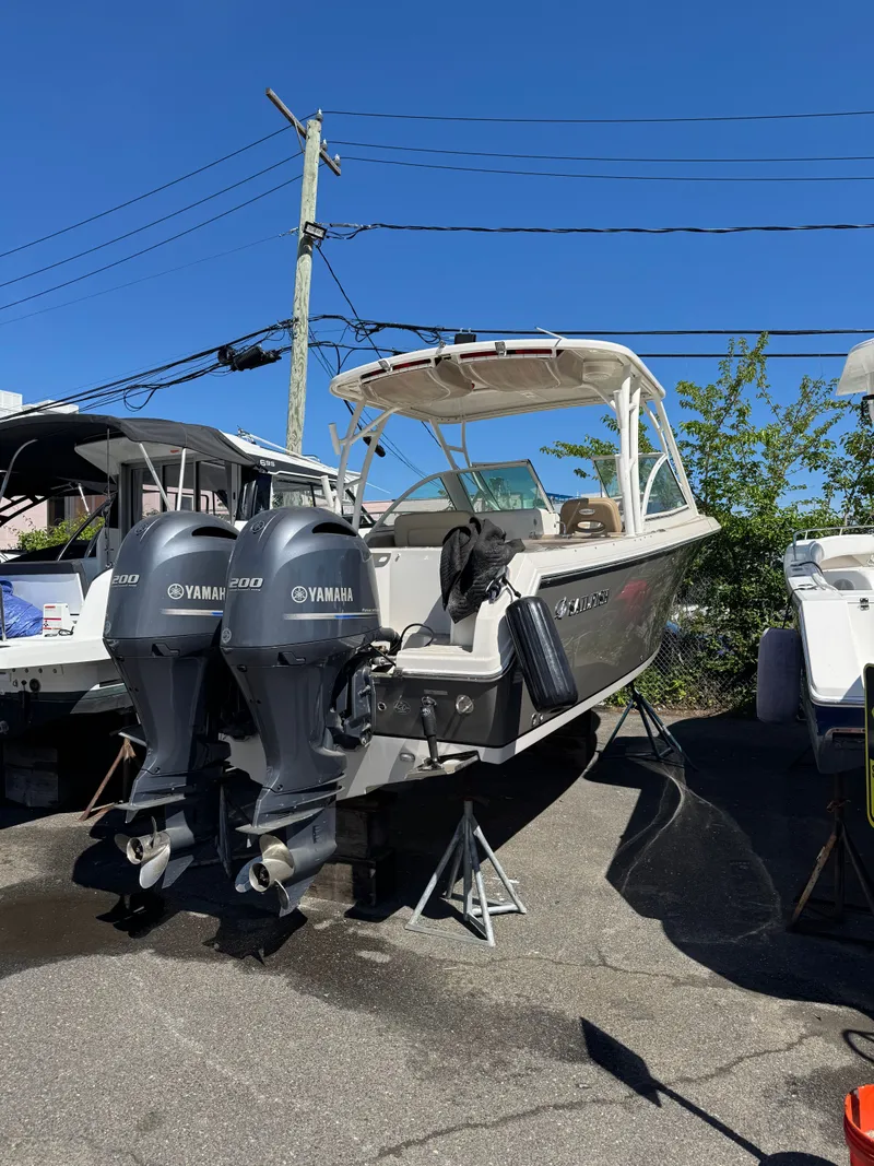 The Image of 2017 Sailfish 275 DC boat with Yamaha engines outdoors. - 1