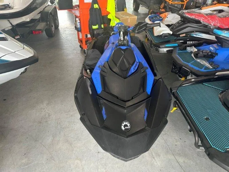 Slide: The Image of 2023 Sea-Doo SPARK 2up Trixx in a workshop. - 3