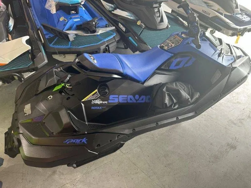 Slide: The Image of 2023 Sea-Doo SPARK 2up Trixx jet ski in a garage. - 4