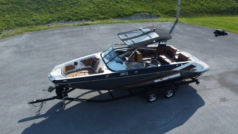 The Image of 2018 Scarab 255 ID Wake Ed boat on trailer, aerial view. - 1