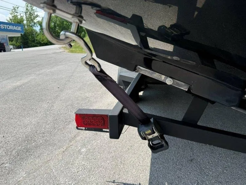Slide: The Image of 2018 Scarab 255 ID Wake Ed boat secured on trailer. - 15