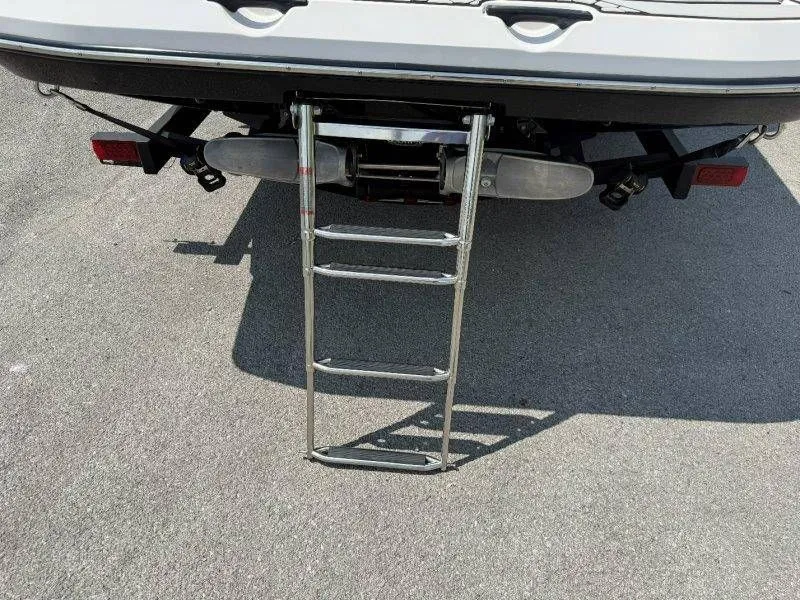 Slide: The Image of Rear view of 2018 Scarab 255 ID Wake Ed with extended ladder. - 16