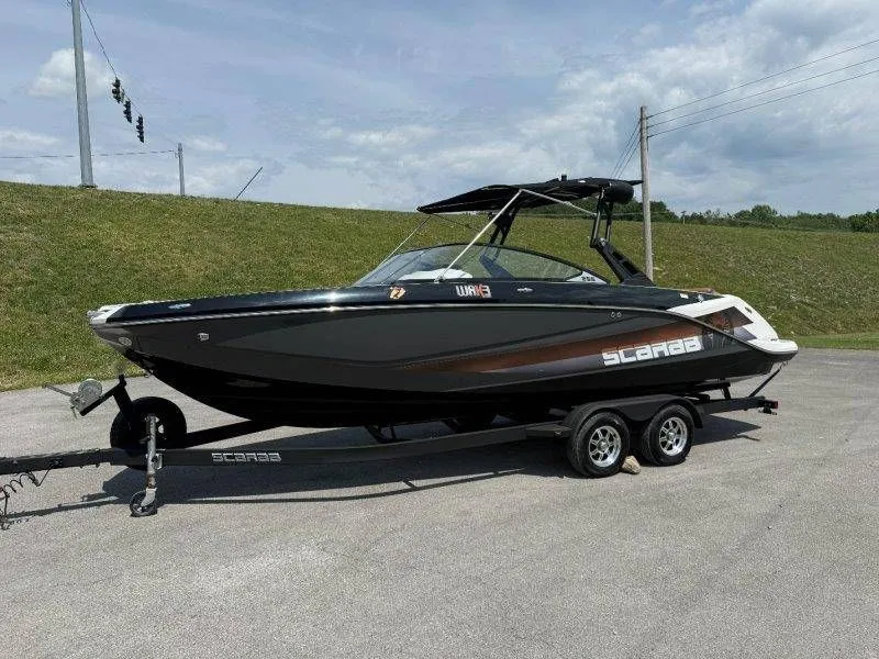 Slide: The Image of 2018 Scarab 255 ID Wake Ed boat on trailer. - 24