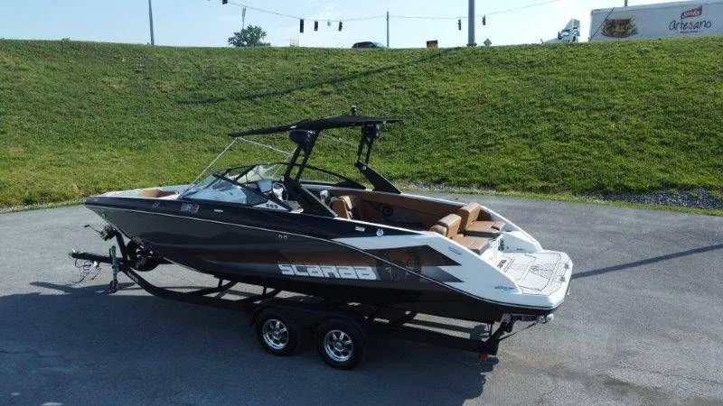 Slide: The Image of 2018 Scarab 255 ID Wake Ed boat on trailer. - 3