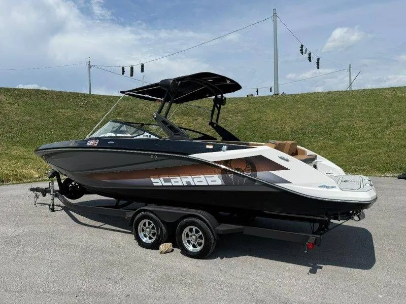 Slide: The Image of 2018 Scarab 255 ID Wake Ed boat on trailer. - 30