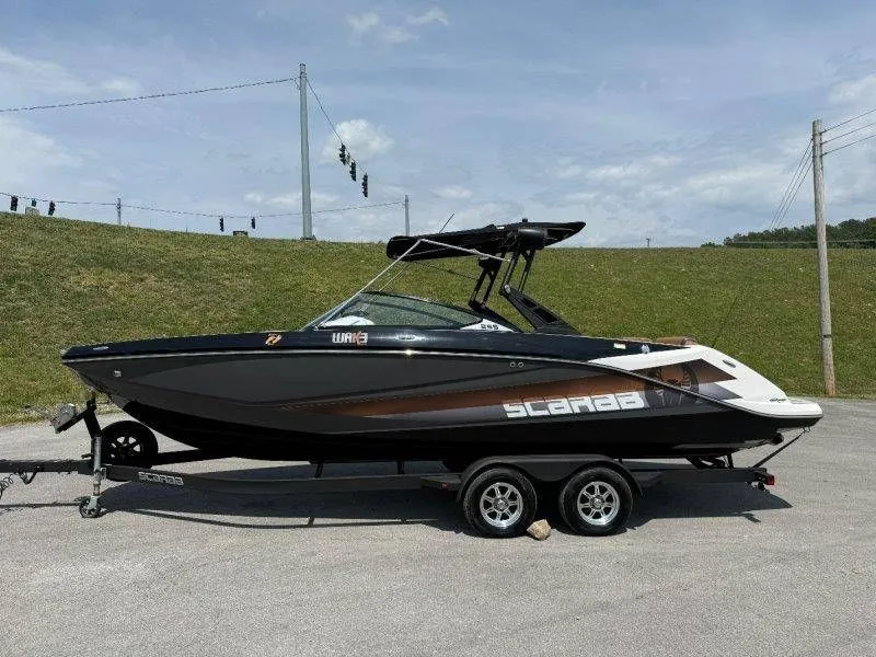 Slide: The Image of 2018 Scarab 255 ID Wake Ed boat on trailer, side view. - 31