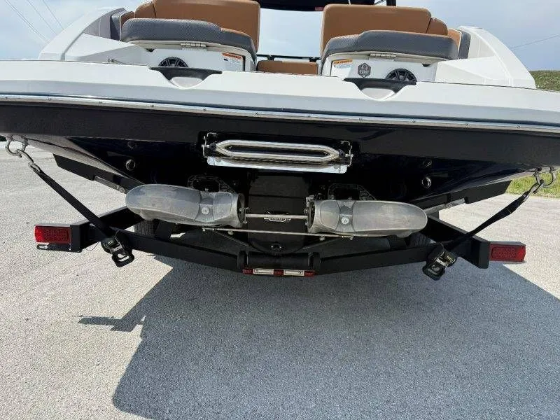 Slide: The Image of Rear view of 2018 Scarab 255 ID Wake Ed boat on trailer. - 33