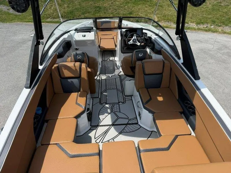 Slide: The Image of Interior of a 2018 Scarab 255 ID Wake Ed boat with brown seating. - 34