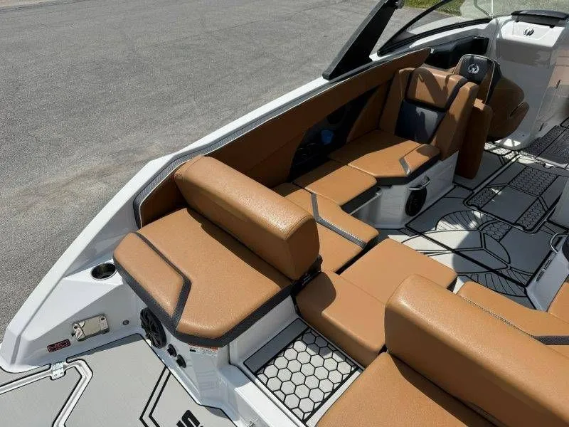 Slide: The Image of Interior of a 2018 Scarab 255 ID Wake Ed boat with brown seating. - 35