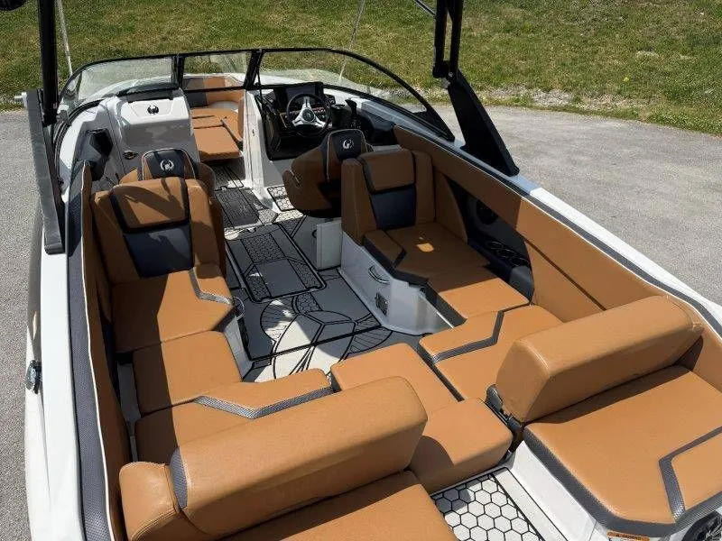 Slide: The Image of Interior of a 2018 Scarab 255 ID Wake Ed boat with brown seating. - 36