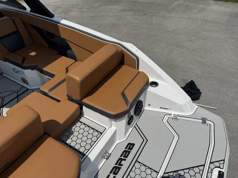 Slide: The Image of Interior of a 2018 Scarab 255 ID Wake Ed boat with brown seating. - 40