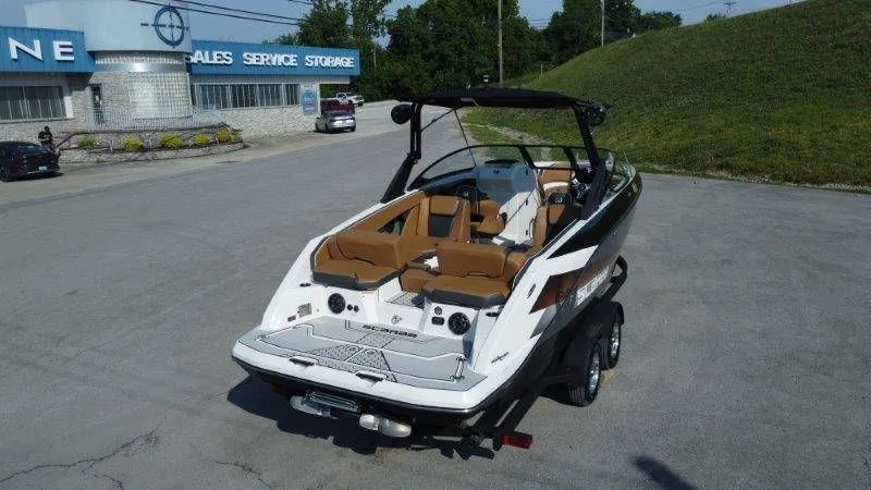 Slide: The Image of 2018 Scarab 255 ID Wake Ed boat on trailer, parking lot view. - 7