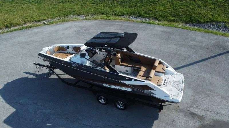 Slide: The Image of 2018 Scarab 255 ID Wake Ed boat on trailer, side view. - 9