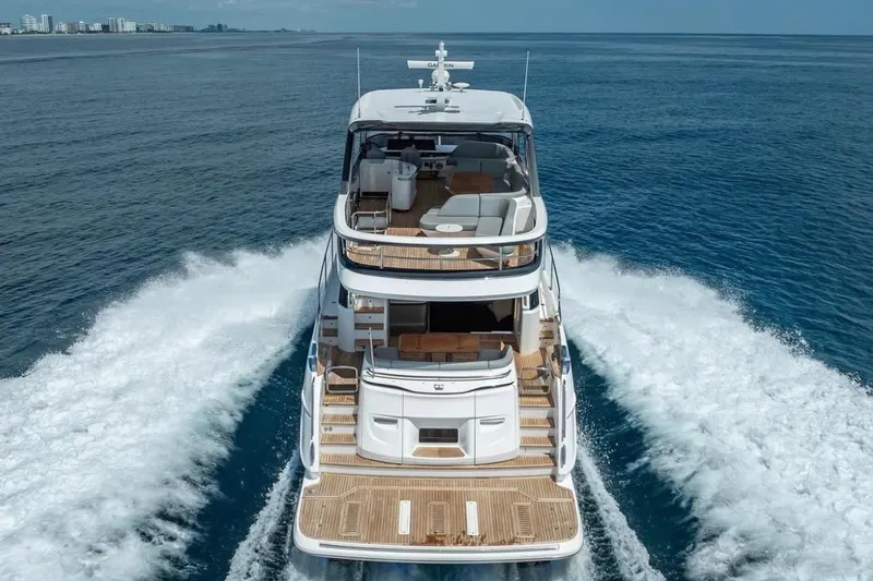 Slide: The Image of 2023 Princess F65 yacht cruising on open sea, showcasing luxurious design and spacious decks. - 23