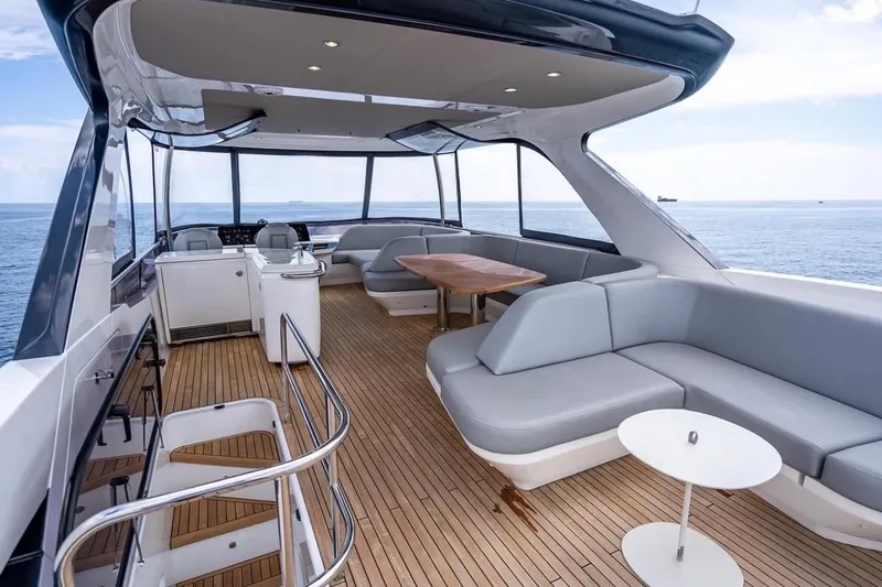 Slide: The Image of Luxurious 2023 Princess F65 yacht interior with sleek seating and ocean view. - 26