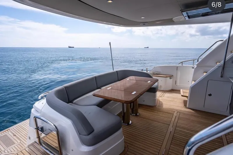 Slide: The Image of Luxurious 2023 Princess F65 yacht deck with ocean view and elegant seating area. - 27