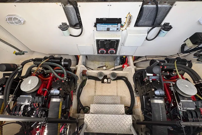 Slide: The Image of Engine room of 2004 Luhrs 30 Open boat with dual engines and control panel. - 15