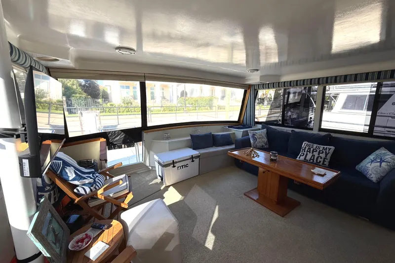 Slide: The Image of Interior of 1991 Californian 55 Cockpit Motor Yacht with cozy seating and decor. - 15
