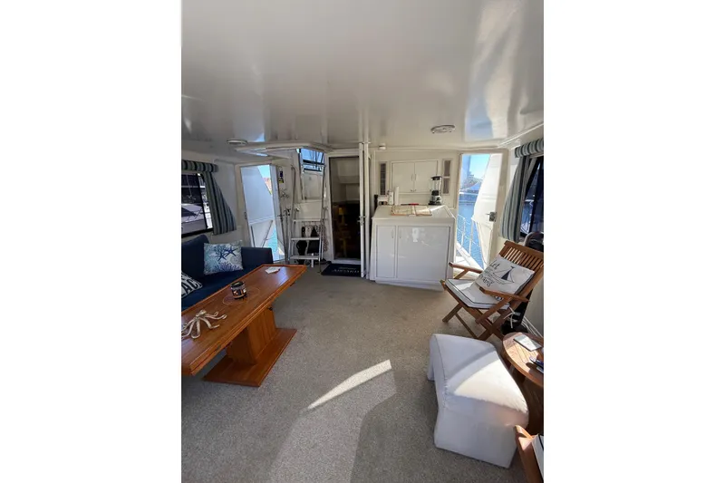 Slide: The Image of Luxurious interior of 1991 Californian 55 Cockpit Motor Yacht with elegant seating and decor. - 16
