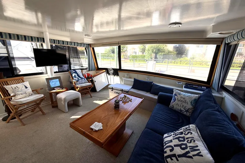 Slide: The Image of Luxurious interior of 1991 Californian 55 Cockpit Motor Yacht with cozy seating and decor. - 17