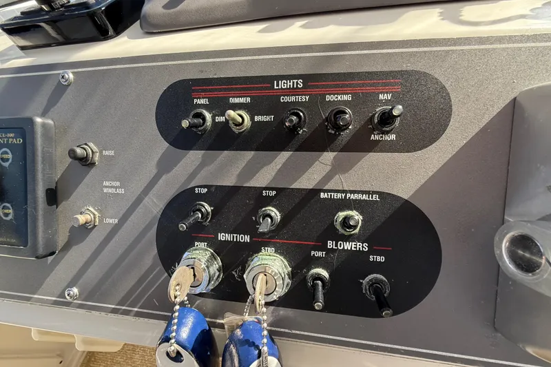 Slide: The Image of Control panel of 1991 Californian 55 Cockpit Motor Yacht with switches and keys. - 28