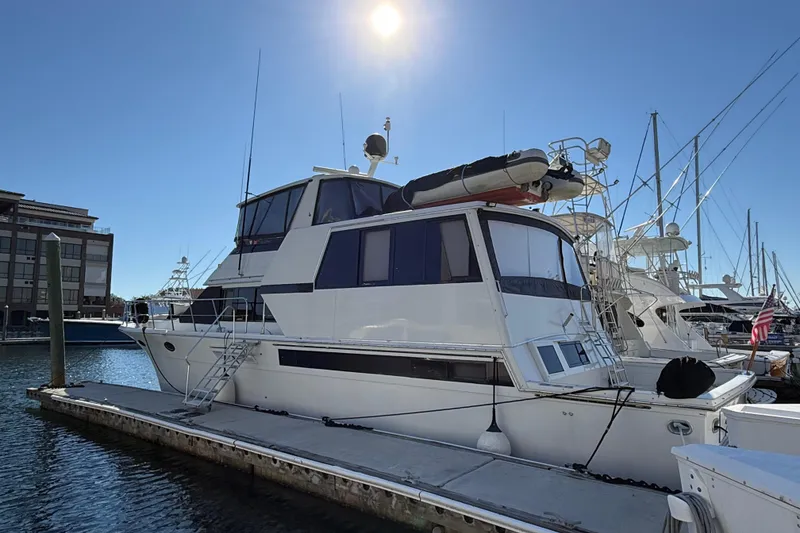 Slide: The Image of 1991 Californian 55 Cockpit Motor Yacht docked under clear blue sky. - 3