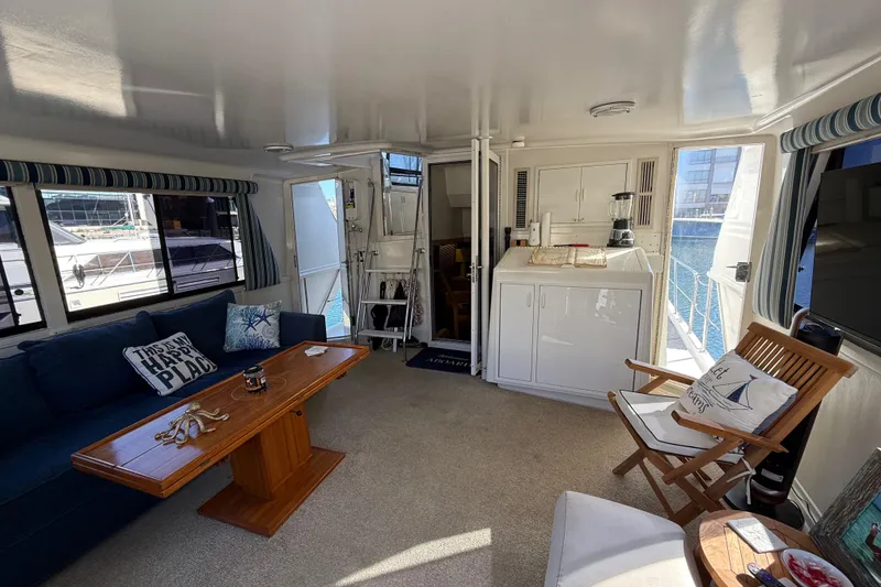 Slide: The Image of Interior of 1991 Californian 55 Cockpit Motor Yacht with cozy seating and nautical decor. - 33