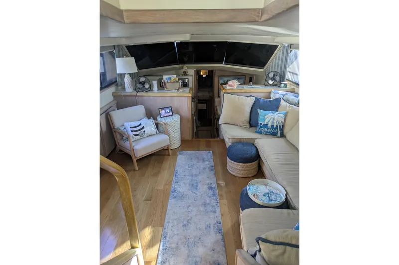 Slide: The Image of Luxurious interior of a 1991 Californian 55 Cockpit Motor Yacht with cozy seating and decor. - 38