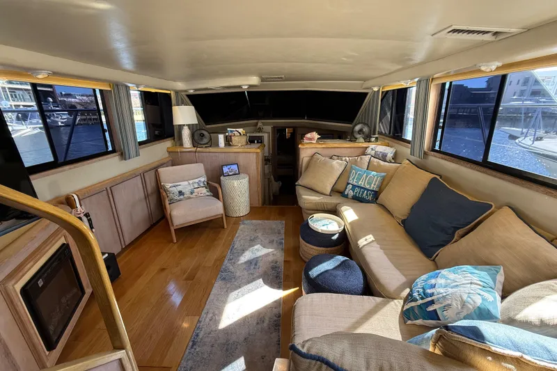 Slide: The Image of Luxurious interior of a 1991 Californian 55 Cockpit Motor Yacht with cozy seating and nautical decor. - 39