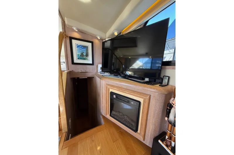 Slide: The Image of Interior of 1991 Californian 55 Cockpit Motor Yacht with TV and fireplace. - 42