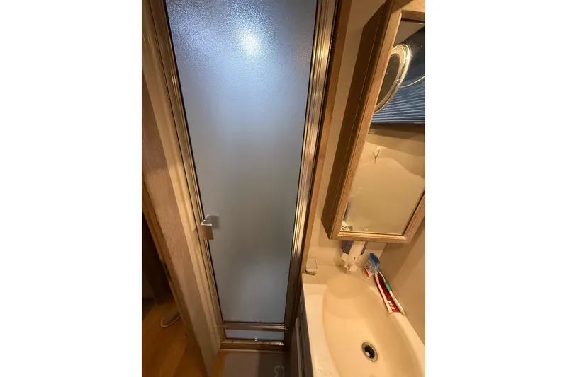 Slide: The Image of Bathroom interior of 1991 Californian 55 Cockpit Motor Yacht with shower and sink. - 47