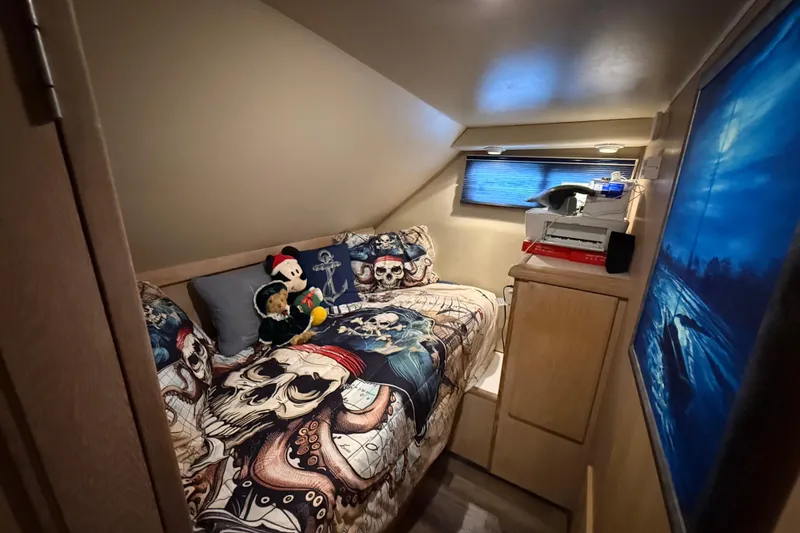 Slide: The Image of Cozy cabin with pirate-themed bedding on 1991 Californian 55 Cockpit Motor Yacht. - 50