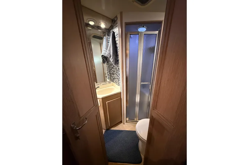 Slide: The Image of Bathroom interior of 1991 Californian 55 Cockpit Motor Yacht with shower and vanity. - 63