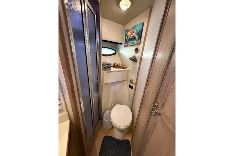Slide: The Image of Bathroom interior of 1991 Californian 55 Cockpit Motor Yacht with shower and marine decor. - 64
