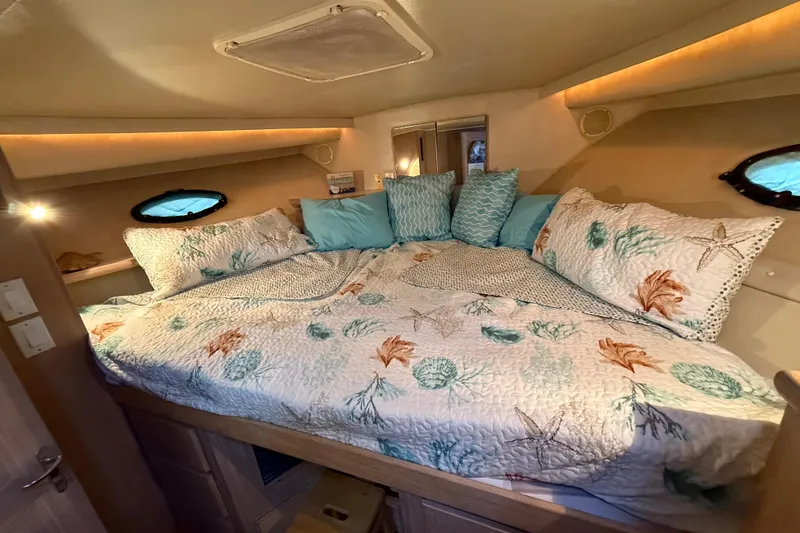 Slide: The Image of Cozy bedroom in 1991 Californian 55 Cockpit Motor Yacht with nautical-themed bedding. - 66