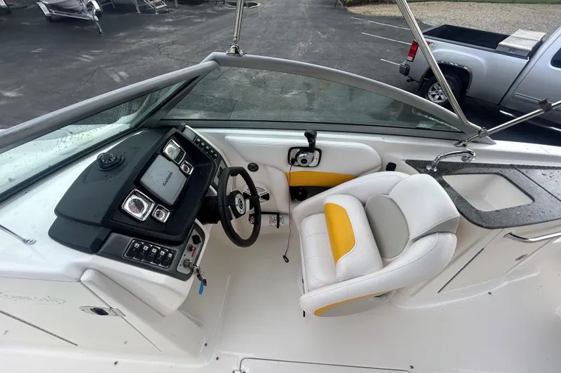 Slide: The Image of 2008 Chaparral Sunesta 244 boat cockpit with steering wheel and control panel. - 14