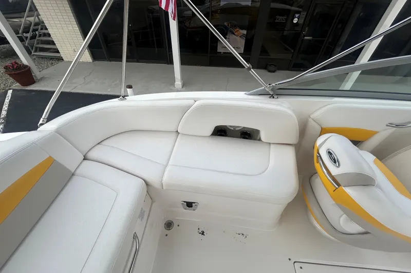 Slide: The Image of 2008 Chaparral Sunesta 244 boat interior with white and yellow seating. - 16