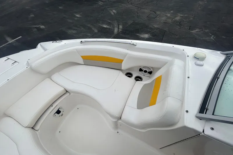Slide: The Image of 2008 Chaparral Sunesta 244 boat interior with white and yellow seating. - 17