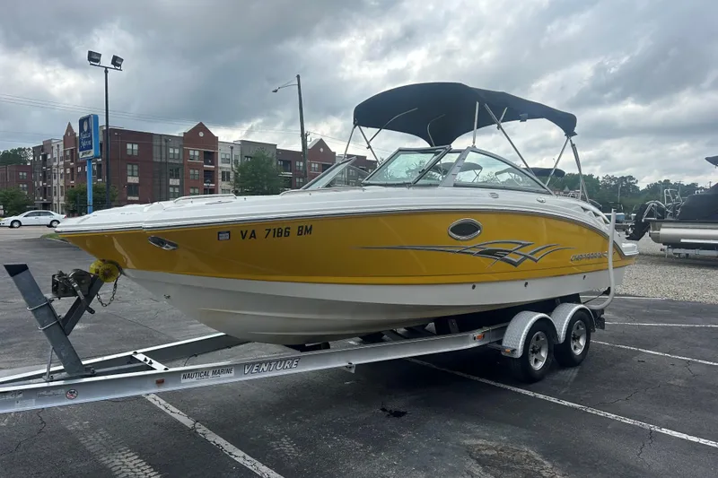 Slide: The Image of 2008 Chaparral Sunesta 244 boat on trailer in parking lot, overcast sky. - 3